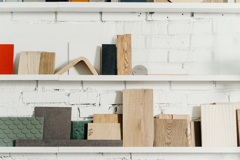 Close-up of shelves showcasing various wooden planks and materials in a workshop environment.